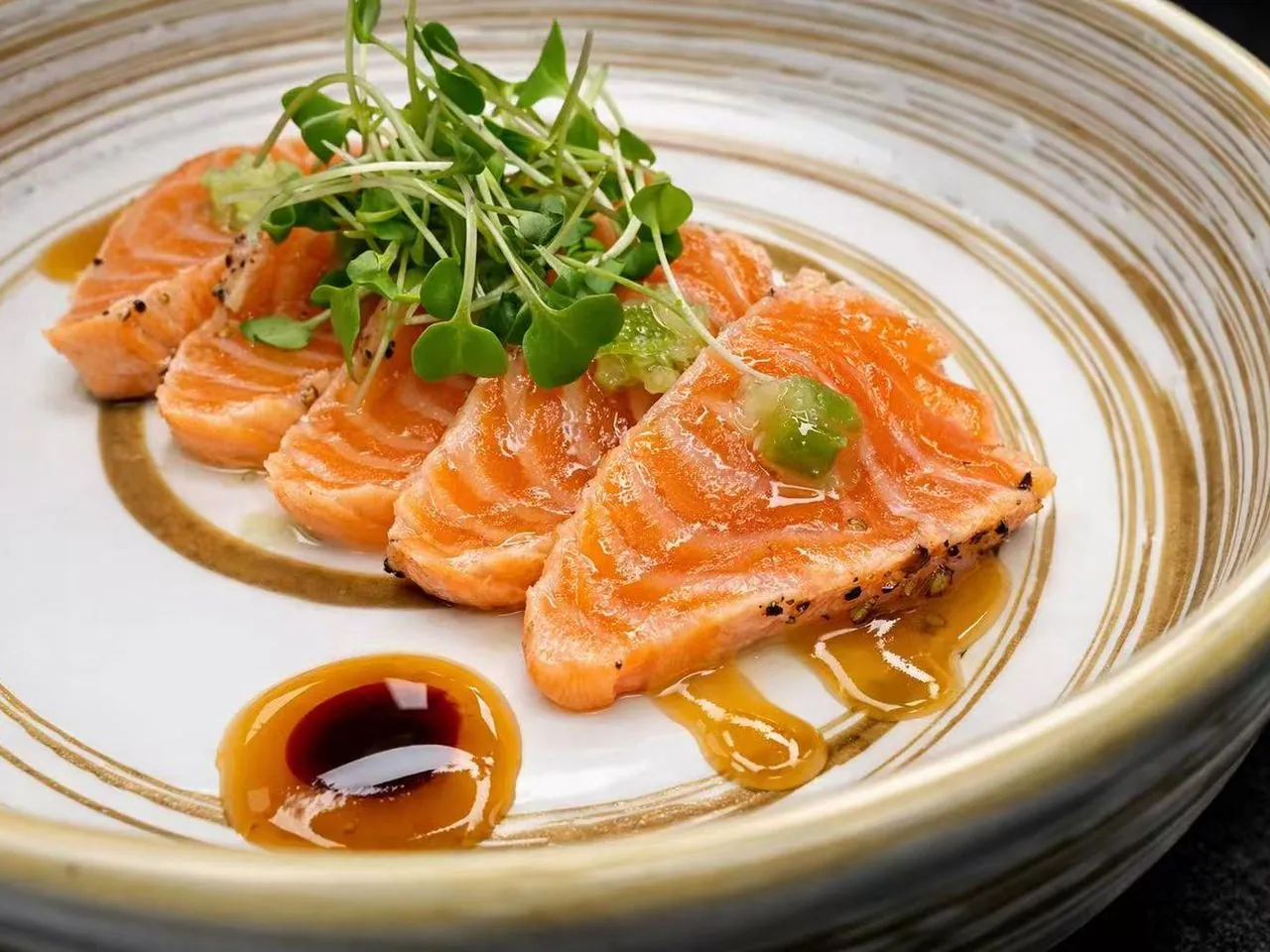 Thinly sliced salmon with citrus soy sauce and microgreens at Torii Japanese Inspired, a Japanese Restaurant in Katy