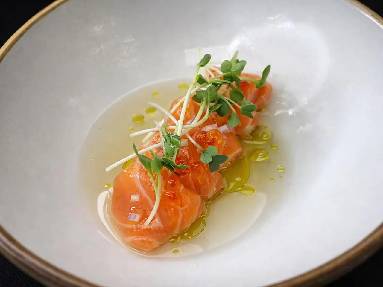 Cured salmon in light citrus broth with microgreens at Torii Japanese Inspired, a Japanese Restaurant in Katy