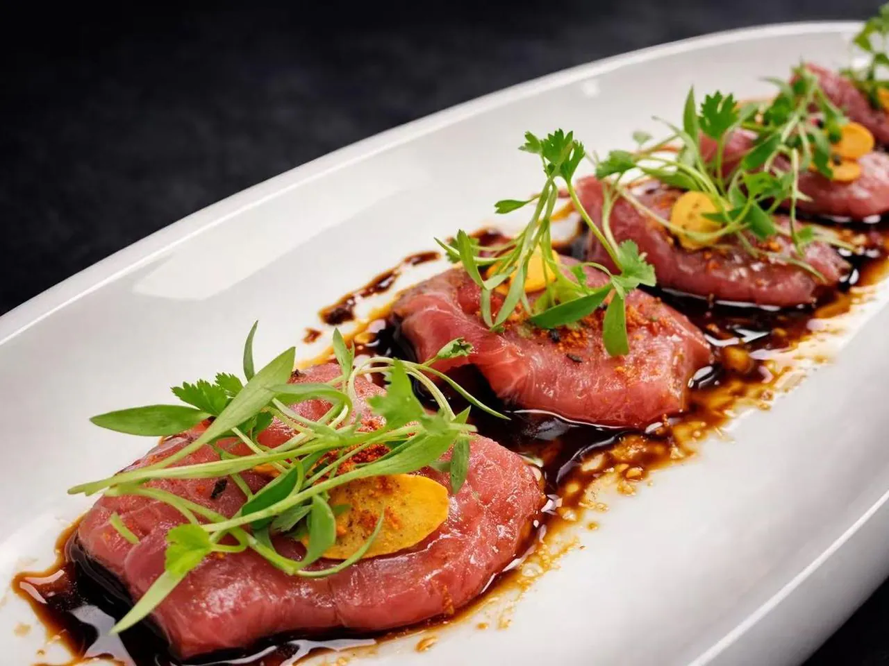 Thinly sliced beef with balsamic glaze and microgreens at Torii Japanese Inspired, a Japanese Restaurant in Katy